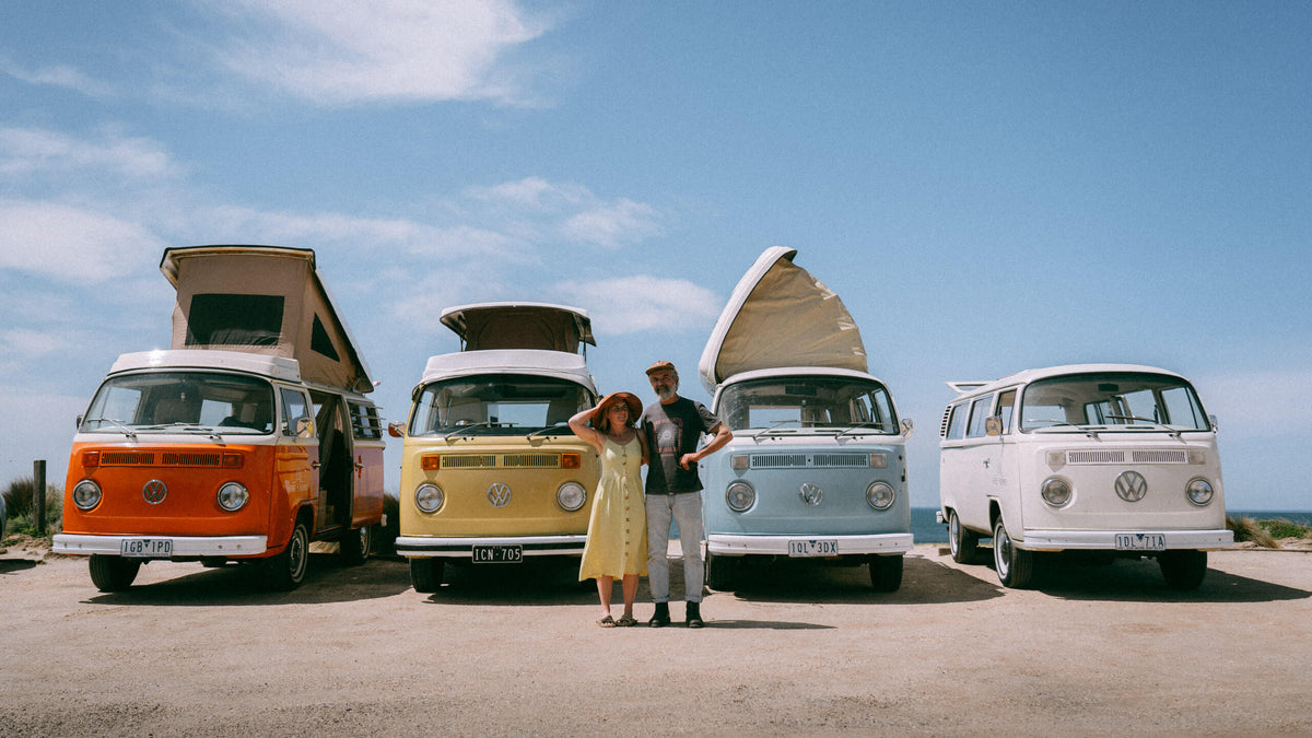 Restored Volkswagen Kombis in Hire A Kombi's fleet beside the coast